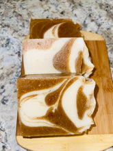 Load image into Gallery viewer, Noureture By Nature’s Ginger Turmeric Honey Handmade Soap. Handmade Vegan Soap. Organic Ingredients Soap. All-Natural Handmade Soap. Cruelty Free Ingredients Soap. Small Business Soap. Black Women in Business Soap. Handmade Soap on a wooden board, placed on top of kitchen counter. Nigerian Shea Butter Handmade Soap.
