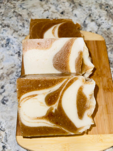 Noureture By Nature’s Ginger Turmeric Honey Handmade Soap. Handmade Vegan Soap. Organic Ingredients Soap. All-Natural Handmade Soap. Cruelty Free Ingredients Soap. Small Business Soap. Black Women in Business Soap. Handmade Soap on a wooden board, placed on top of kitchen counter. Nigerian Shea Butter Handmade Soap.